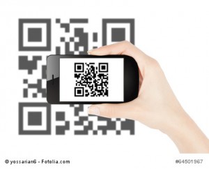 Woman hand scanning qr code with smart phone